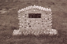 Concrete grave marker decorated with shells and beach glass, dedicated to David Joseph Marchand (1956), old Saint-Louis cemetery in Louisdale, Cap Breton. Photo D. Trask © S. Ross