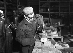 A young apprentice learning the art of torch welding at the Maisonneuve school, Montreal, 1949