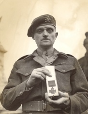 Major Paul Triquet leaves Buckingham Palace after having received his Victoria Cross (VC) from His Majesty, King George VI