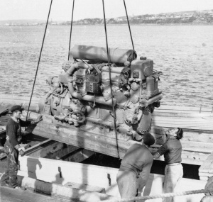 The engine is lowered into the schooner's hold