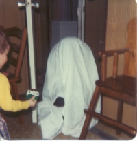 David Deveaux receiving sweets from the black-gloved Mi-Carême in 1982.  Photo:  Ellen Deveaux