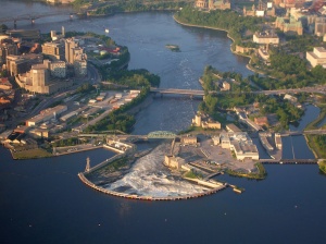 The Chaudière site: in the centre, the main falls contained by the semi-circular dam; on the left, the Gatineau shore; on the right, the islands, former timber slides and the Ottawa shore, 2006